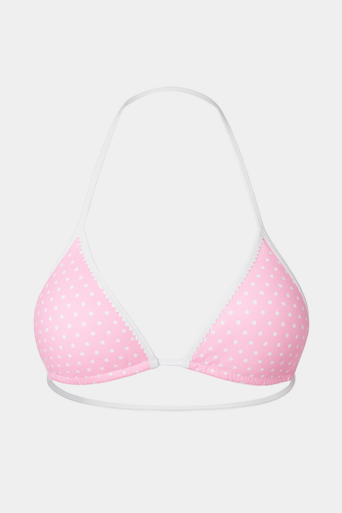 Pink polka dot bikini top on a white background